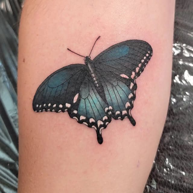 Healed butterfly tattoo